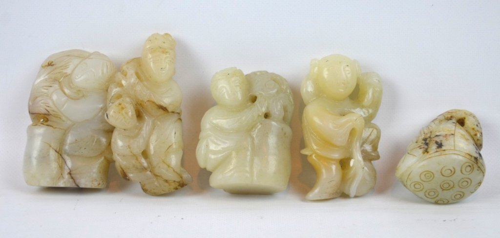 5 - Antique Chinese Carved White Jade Figures: 5 - Antique Chinese Carved White Jade Figures; 2 are figural toggles, two are figural statues with flat bottoms, one is a lotus seed pod toggle. Good condition. Height of largest 2 3/4 inches (7 cm.).