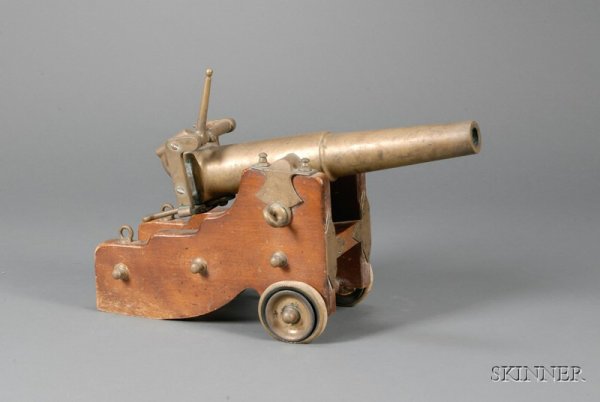 Barney & Berry "Reliable" Signal Cannon, Springfie: Barney & Berry "Reliable" Signal Cannon, Springfield, Massachusetts, early 20th century, with patent date October 12, 1901, 4 gauge, model no. 108, bronze with mahogany base, and pair of rubber wheels