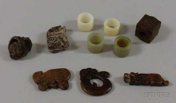Ten Assorted Carved Hardstone Pendants and Other I: Ten Assorted Carved Hardstone Pendants and Other Items, of various forms, including a carved dragon figure, a dragon pendant, a square bangle, two green jade bangles, two white jade bangles, and three