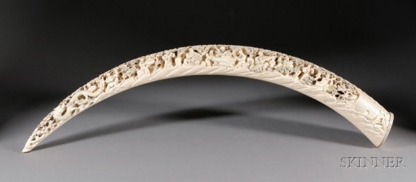 Carved Ivory Tusk, China, scene of the Immortals a: Carved Ivory Tusk, China, scene of the Immortals at Po Shan, wooden stand, lg. 52 in.