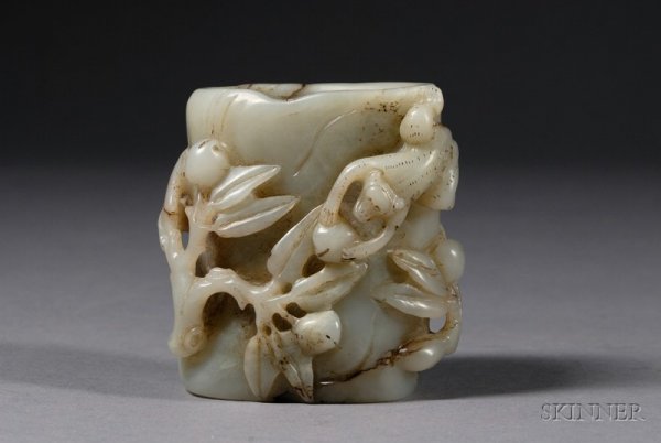 Jade Brush Holder, China, surface carved in high r: Jade Brush Holder, China, surface carved in high relief with monkeys and peaches, ht. 3 1/2 in.