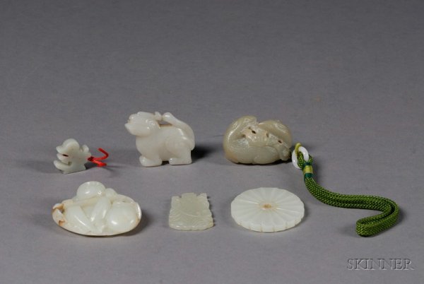 Six Jade Carvings, China, 19th century, a monkey, : Six Jade Carvings, China, 19th century, a monkey, a pair of deer, a kylin, a plaque of the god of wealth, a Chinese character, and a foliate pi disk.