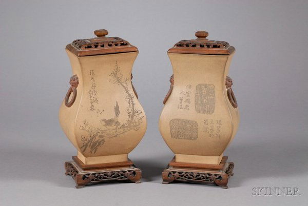 Pair of Stoneware Jars, China, 19th century, Yi H: Pair of Stoneware Jars, China, 19th century, Yi Hsing ware, square form with lion mask handles, surface engraved with birds and flowers, hardwood stands and covers, ht. 9 1/2 in.
