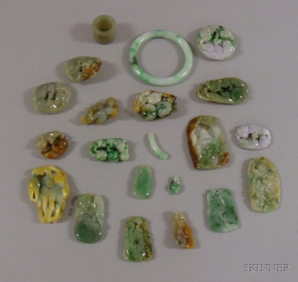 Twenty-one Carved Jade Pendants and Other Items, o: Twenty-one Carved Jade Pendants and Other Items, of various sizes including a round carved animal pendant, a fat man rectangular figure, dragons, etc.