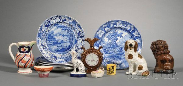 Fourteen English Pottery Items and a Redware Lion: Fourteen English Pottery Items and a Redware Lion Figure, 19th century, including a spaniel figure with copper luster highlights, a Dalmatian figure, a pitcher, a small canary yellow mug with transfer