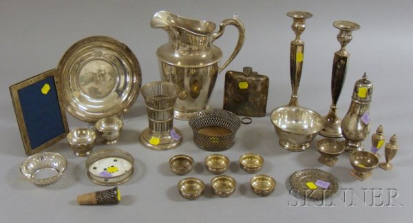 Group of Sterling and Silver Plated Serving Items,: Group of Sterling and Silver Plated Serving Items, including a sterling silver water pitcher, an Apollo Co. silver plated flask with hinged cap, a sterling Watson holder (missing insert), a caster, a 