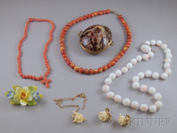 Small Lot of Assorted Jewelry, including a Trifari: Small Lot of Assorted Jewelry, including a Trifari faux angelskin coral bead necklace, a pink coral necklace, a wooden bead necklace, a carved bone suite, a painted porcelain floral brooch, and a bras