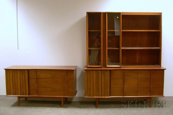 United Mid-century Modern Walnut Credenza and Two-: United Mid-century Modern Walnut Credenza and Two-part Breakfront, respective ht. 30 3/4, lg. 56, and ht. 73 1/4, lg. 62 in.