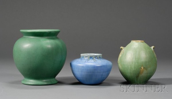 Three Pottery Vessels Glazed earthenware United Sta: Three Pottery Vessels Glazed earthenware United States An unmarked Roseville in tourmaline glaze; a bulbous vase in green glaze; and ovoid lamp base in green glaze with oak leaves at sides, undetermin