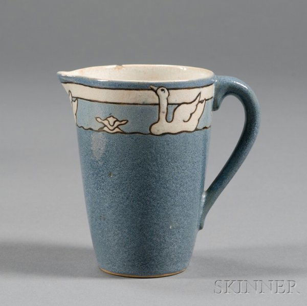 Saturday Evening Girls Pitcher Decorated pottery Bo: Saturday Evening Girls Pitcher Decorated pottery Boston, Massachusetts, 1912 Border decorated with swans in white with blue glazed body, rim chip, marked TB for Tiley Block, 140-1-12, S.E.G., ht. 4 3/