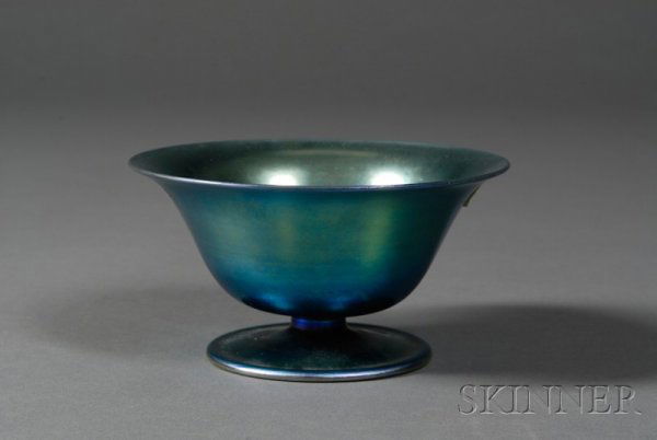 Steuben Blue Aurene Bowl Art glass Corning, New Yo: Steuben Blue Aurene Bowl Art glass Corning, New York, early 20th century Flared rim on conical bowl raised on circular foot in blue iridescence, rolled base rim, rough pontil marked aurene and numbere
