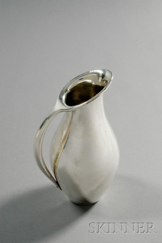 Johan Rhode Georg Jensen Pitcher Sterling silver D: Johan Rhode Georg Jensen Pitcher Sterling silver Denmark, mid-20th century Angular spout continuing to handle on bulbous hammered body, marked Dessin, Johan Rhode cartouche, Denmark, Sterling, Georg J