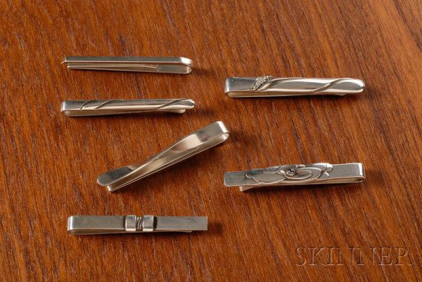 Six Georg Jensen Tie Bars Sterling silver Denmark: Six Georg Jensen Tie Bars Sterling silver Denmark Variety of streamline designs, all marked Georg Jensen in a beaded oval, 925S, Denmark, numbers, 404, 74A, 161, 162, two signed Hans Hansen, lg. 2 3/8