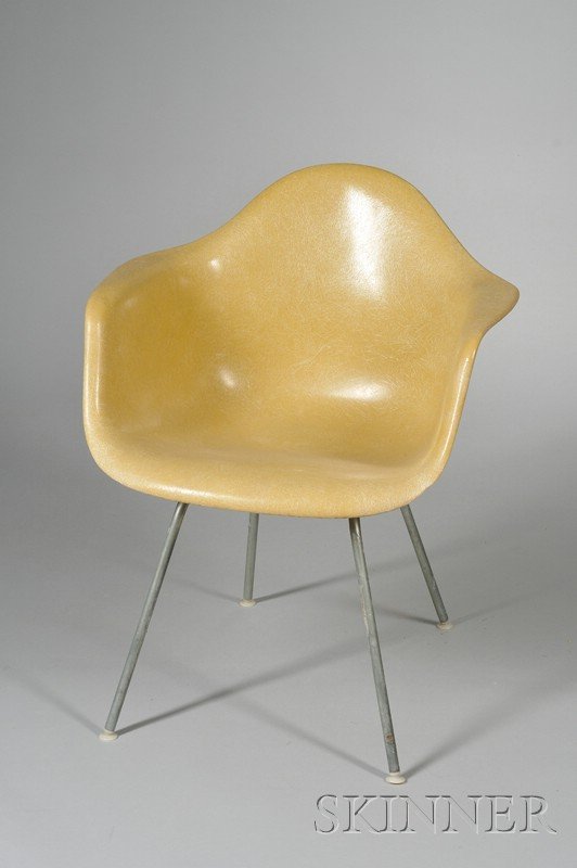 Charles and Ray Eames Chair Fiberglass, metal, and: Charles and Ray Eames Chair Fiberglass, metal, and rubber Herman Miller, Zeeland, Michigan Yellow fiberglass bucket seat with rubber mounts raised on four metal rod legs, paper label, impressed Herman