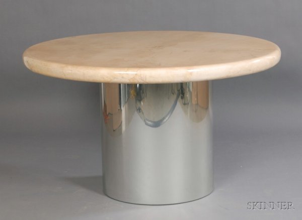 Karl Springer Dining Table Laminate, wood and meta: Karl Springer Dining Table Laminate, wood and metal Designer Martin Kuckley, New York, 1982 Ivory lacquered goatskin finish on circular top, over round chrome center column base, ht. 31, dia. 52 in. N