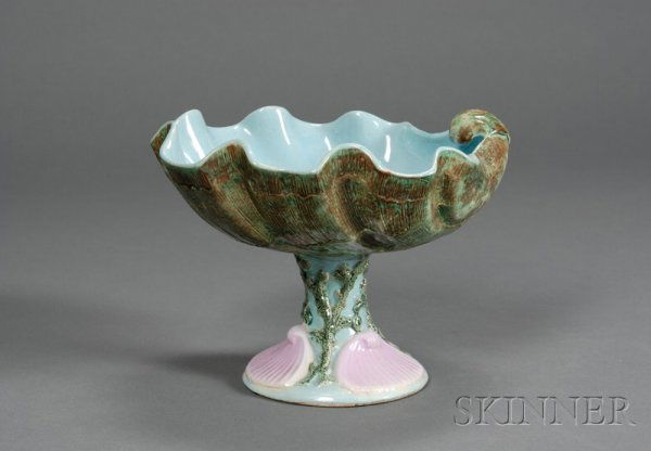 Holdcroft Majolica Shell Compote, England, c. 1880: Holdcroft Majolica Shell Compote, England, c. 1880, modeled as a deep shell-form bowl, the tall base decorated with shells and coral, impressed mark, ht. 7 1/4 in.