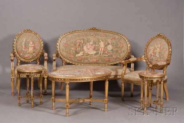 Suite of Louis XVI Style Giltwood and Faux Tapestr: Suite of Louis XVI Style Giltwood and Faux Tapestry Upholstered Seating Pieces, 20th century, comprising four armchairs and a settee, each with ribbon twist borders and foliate carving; together with