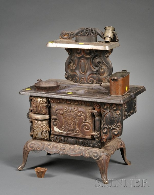 Large Cast Iron Toy Stove, late 19th century, "Fav: Large Cast Iron Toy Stove, late 19th century, "Favorite Stove/Ranges," working range, steel stove, pipe, steel ash bin, cast iron coal scuttle and frying pan, copper wash boiler, (stove lifter missing
