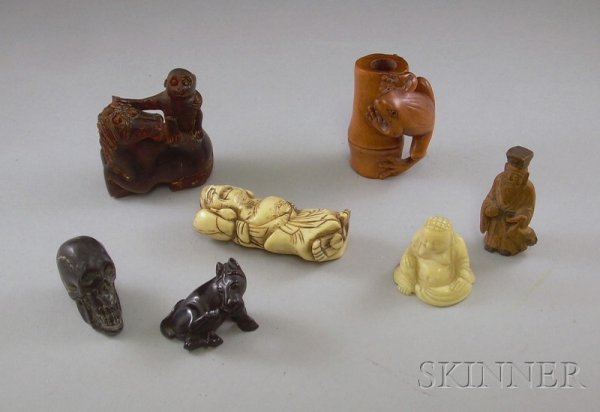 Seven Netsuke, an ivory standing figure of a man, : Seven Netsuke, an ivory standing figure of a man, an ivory seated Buddha, a frog, a bone horse with animal, and a synthetic skull and horse.