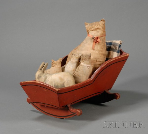 Red-painted Doll Cradle with Four Lithographed Clo: Red-painted Doll Cradle with Four Lithographed Cloth Cats and a Rabbit, America, late 19th/early 20th century, also including two blue and white woven cotton plaid covered pillows, cradle ht. 10 1/2, 