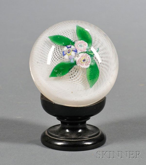 Glass Paperweight with Millefiore Flowers, attribu: Glass Paperweight with Millefiore Flowers, attributed to the Boston & Sandwich Glass Company, Sandwich, Massachusetts, c. 1851-80, centered with three millefiore blossoms with lampwork leaves on a whi