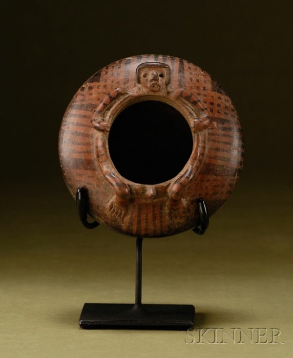 Pre-Columbian Pottery "Maternity" Bowl, Colombia, N: Pre-Columbian Pottery "Maternity" Bowl, Colombia, Narino, c. 850-1250 A.D., the rim in the form of a male (?) figure, negative resist decoration, includes stand, (surface loss at bottom), ht. 3, dia. 