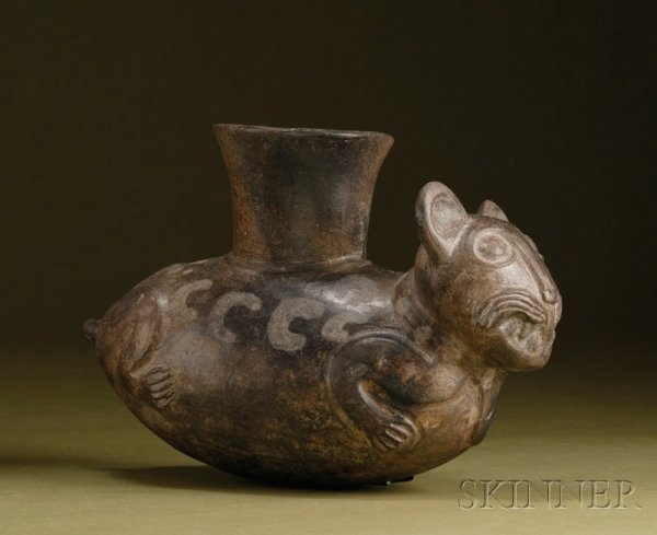 Pre-Columbian Pottery Effigy Vessel, Inca, 1300-140: Pre-Columbian Pottery Effigy Vessel, Inca, 1300-1400 A.D., depicting a Puma with abstract painted spots, single large spout from the top, the tail perforated for pouring, lg. 9 in.