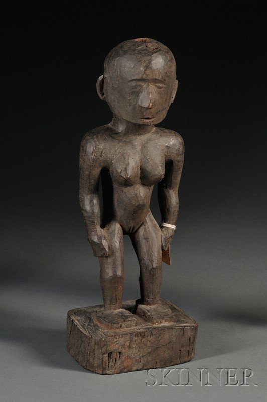 Philippines Carved Wood Female Ancestor Figure, Ig: Philippines Carved Wood Female Ancestor Figure, Igorot, the stylized form standing on a square base with hands to the hips, ht. 15 3/4 in. Provenance: Leo and Lillian Fortess collection.