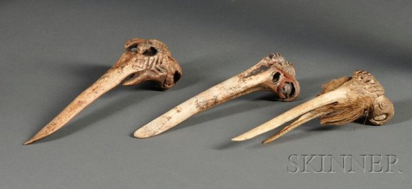 Three New Guinea Carved Bone Implements, all with : Three New Guinea Carved Bone Implements, all with abstract bird heads, incised decoration, and traces of pigment, (damage), lg. to 7 1/2 in. Provenance: Leo and Lillian Fortess collection.