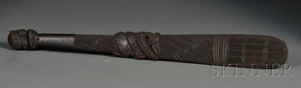 Maori Carved Wood Club, New Zealand, 19th century,: Maori Carved Wood Club, New Zealand, 19th century, the paddle-like form and finial carved with stylized designs, pierced for suspension, lg. 25 1/4 in. Provenance: Collected by Rev. Alfred Fairbrother