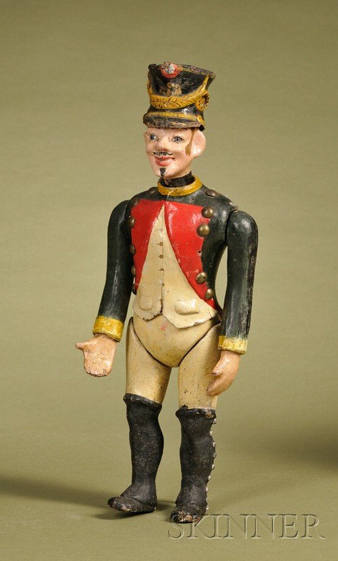 Papier-mache Soldier, France, late 19th century, a: Papier-mache Soldier, France, late 19th century, all molded and painted papier-mache, socket head with blue glass eyes, brown hair and sideburns, separately molded hat, jointed body with molded and pa