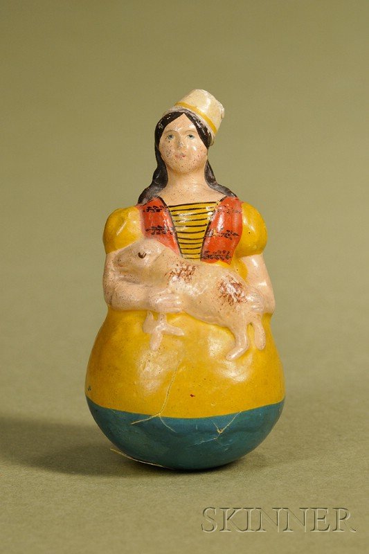 Early Roly Poly Child with Lamb, Germany, c. 1850,: Early Roly Poly Child with Lamb, Germany, c. 1850, papier-mache roly poly of a child with molded hat and long curly hair, blue painted eyes, molded yellow dress, and holding a lamb, ht. 4 in., (very g