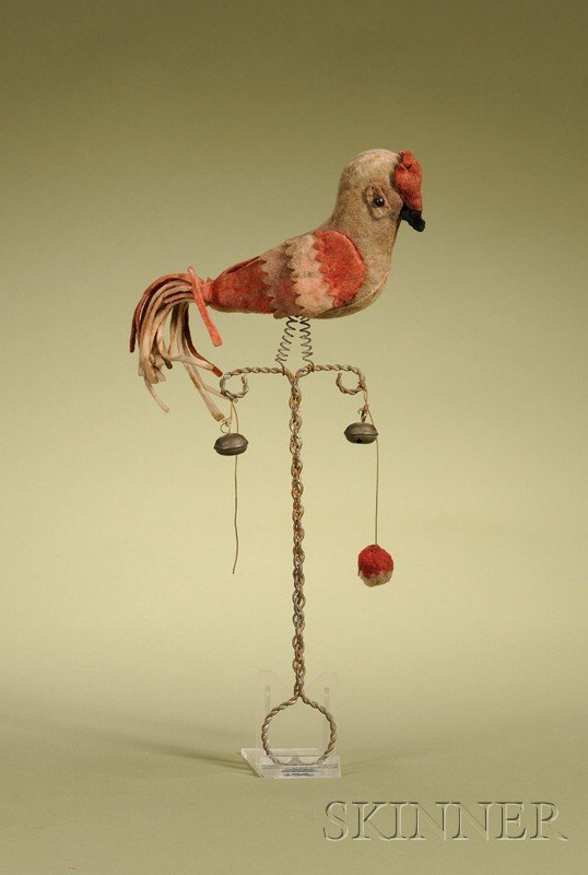 Parrot-form Felt Rattle, Germany, late 19th centur: Parrot-form Felt Rattle, Germany, late 19th century, felt-covered excelsior-stuffed parrot with black shoe button eyes, on wire spring legs, attached to a bent wire handle with two bells, ht. 12 in.,