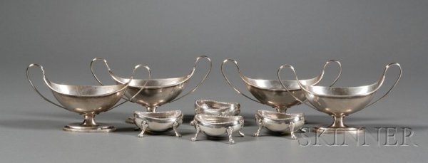 Two Sets of English Silver Open Salt Cellars, Birmi: Two Sets of English Silver Open Salt Cellars, Birmingham, each a set of four, one set 1879, Hilliard & Thomason, makers, oval, with beaded rim and trefoil-topped paw feet, lg. 2 1/2, the other set 190