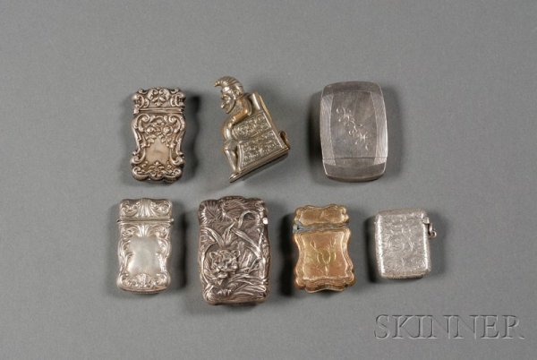 Seven Silver and Silverplate Matchsafes, late 19th: Seven Silver and Silverplate Matchsafes, late 19th/early 20th century, five silver: chased and embossed with tiger emerging from jungle vegetation, two with scrollwork borders, plain line engraved bor