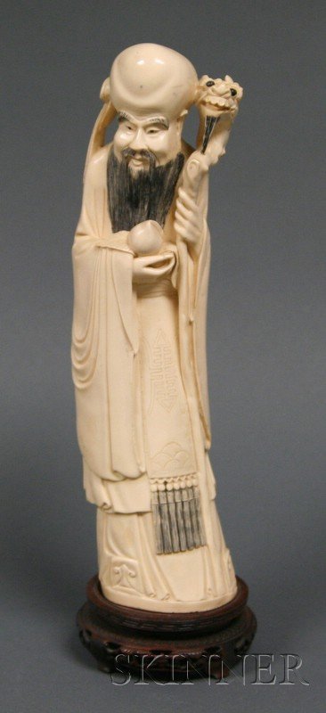 Ivory Carving of Shao Lao, holding a staff and a p: Ivory Carving of Shao Lao, holding a staff and a peach, ht. 13 in.