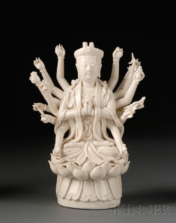 Blanc de Chine Buddhist Divinity, China, 18th/19th: Blanc de Chine Buddhist Divinity, China, 18th/19th century, Te Hua image of Maitreya with sixteen attributes seated on a double lotus throne, signed on the back, (loss and repairs), ht. 10 in.