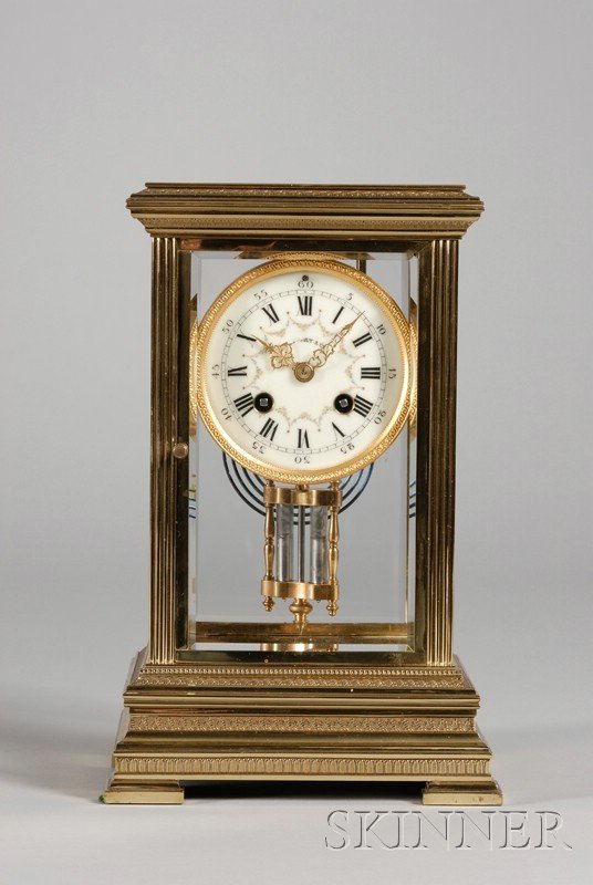 French Crystal Regulator Clock, retailed by Tiffan: French Crystal Regulator Clock, retailed by Tiffany & Co., brass and beveled glass case with reeded corners, cast leafage, enameled dial with Roman numerals and gilt hands and eight-day time and strik