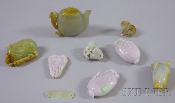 Nine Carved Stone Asian Items, two purple and gree: Nine Carved Stone Asian Items, two purple and green carved fruit with bats, a green and brown carved stone pendant with insects and mythical beast, a white monkey seated on a gray stone carved leaf, a