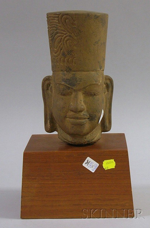 Cambodian Stone Head of Hari-Hara, 12th century st: Cambodian Stone Head of Hari-Hara, 12th century style, sold with a plinth.