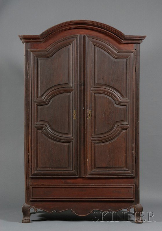 Continental Rococo Oak Armoire, third quarter 18th: Continental Rococo Oak Armoire, third quarter 18th century, likely Dutch, molded cornice above a pair of three-panel doors enclosing a shelved interior, with base drawer and short, cabriole legs, ht. 