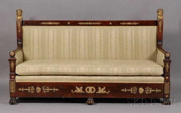 Empire Revival Ormolu-mounted and Part-ebonized Ma: Empire Revival Ormolu-mounted and Part-ebonized Mahogany Sofa, early 19th century, rectangular backrest with supports headed by classical portrait busts and cresting mounted with anthemion, rosettes a