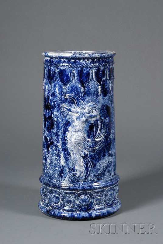 Blue Sponge Decorated Earthenware Garden Seat, lat: Blue Sponge Decorated Earthenware Garden Seat, late 19th century, cylindrical shape with molded drapery and circular medallion bands, central scantily clad classical figure to either side, ht. 21 3/4