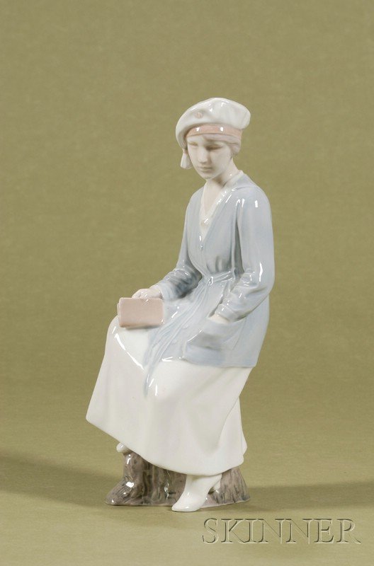 Bing & Grondahl Porcelain Figure of a Scholarly Wo: Bing & Grondahl Porcelain Figure of a Scholarly Woman, Denmark, 20th century, the woman modeled seated on a tree stump and holding a book, ht. 11 1/2 in.