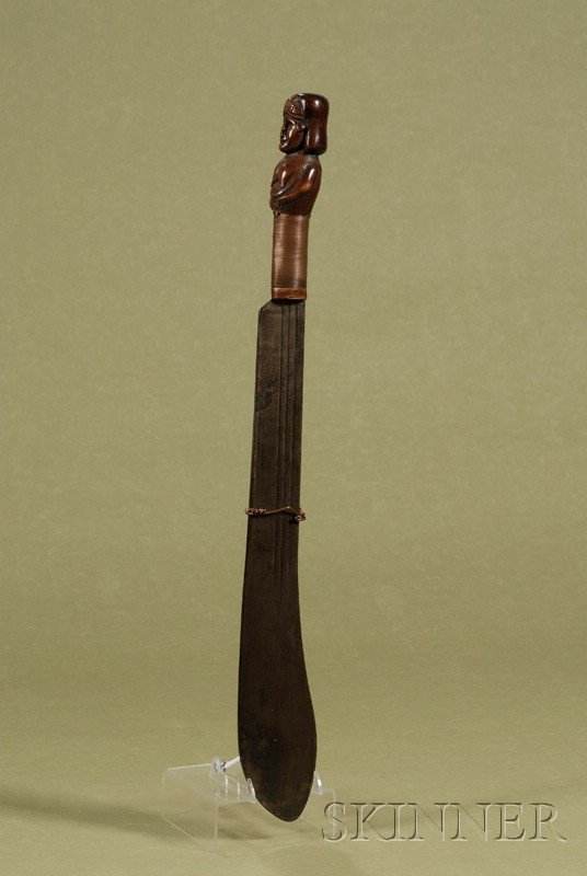 Machete with Carved Handle, possibly South America: Machete with Carved Handle, possibly South American, early 20th century, steel blade, the wood handle carved with the bust of a warrior woman with nose piercing, hilt wrapped in copper wire, handle lg