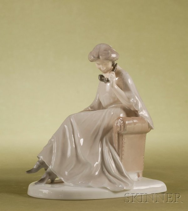 Bing & Grondahl Porcelain Figure, Denmark, c. 1960: Bing & Grondahl Porcelain Figure, Denmark, c. 1960, underglaze enameled depiction of a woman seated and speaking on the telephone, numbered 1706, artist signed Axel Locher, printed factory mark, ht. 7