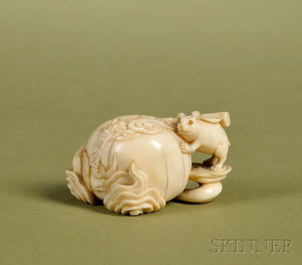 Japanese Edo Period Carved Ivory Netsuke, 19th cen: Japanese Edo Period Carved Ivory Netsuke, 19th century, signed Masahiro and inscribed with the name of his pavilion, depicting a rabbit with a mallet pounding rice cakes against a full moon, eyes inla
