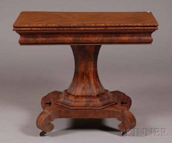 Classical Mahogany and Mahogany Veneer Card Table,: Classical Mahogany and Mahogany Veneer Card Table, New York, c. 1825, the folding top with crossbanded border, on conforming ogee molded and beaded frame, on shaped paneled and ogee-molded octagonal s