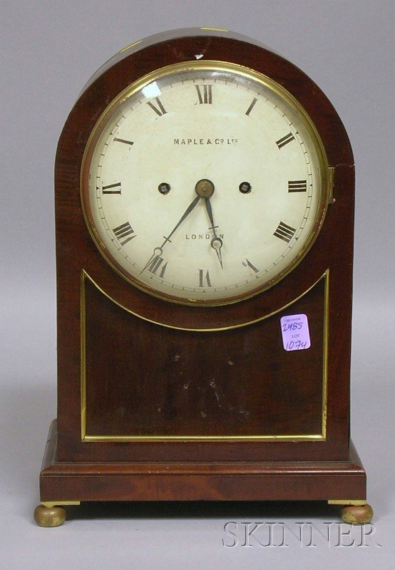 Mahogany Bracket Clock by Maple & Co., London, wi: Mahogany Bracket Clock by Maple & Co., London, with convex painted iron dial signed with maker's name, brass trim and side sound vents, ball feet, and eight-day time and strike fusee movement with bra