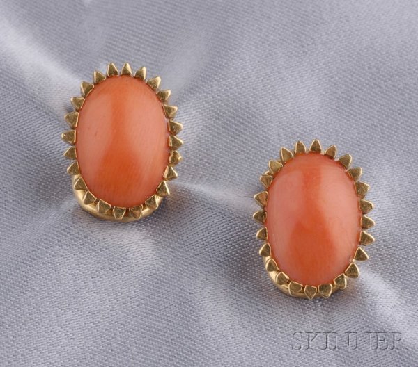 18kt Gold and Coral Earclips, each set with an ova